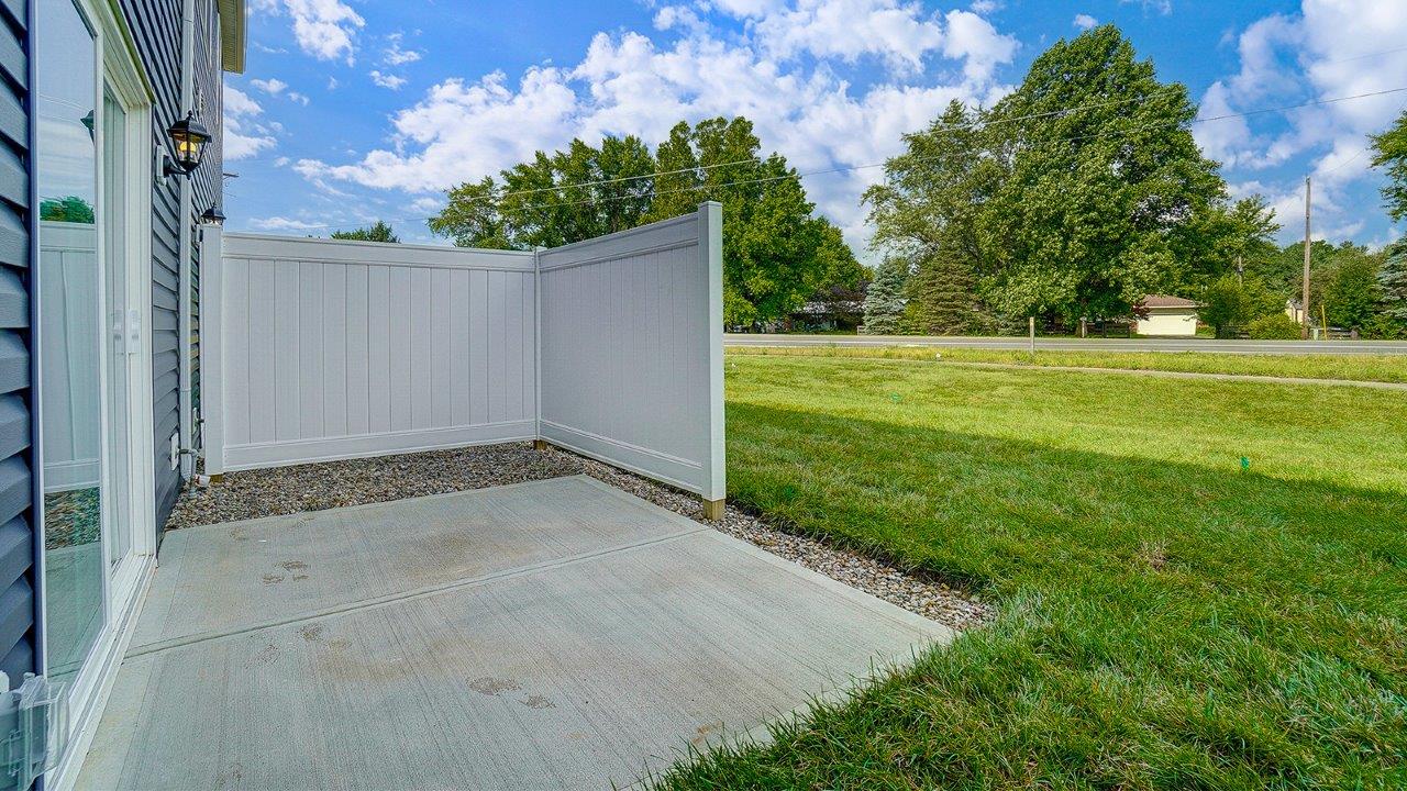 rear patio with partially fenced patio