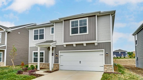 single story home with grey siding, covered entry, two car garage