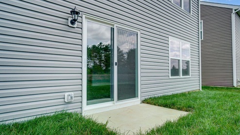 rear sliding door with small concrete slab