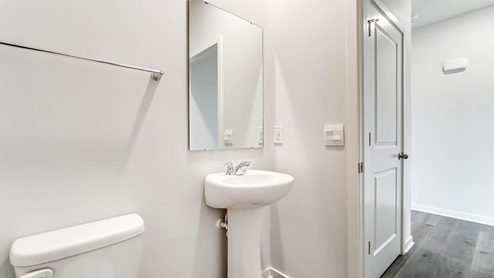 first floor powder room with pedestal sink