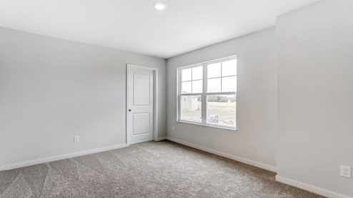 fourth bedroom with closet and double window