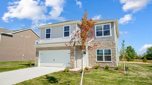 two story home with grey siding, partial stone front, covered entry, two car garage