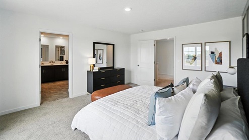 furnished primary bedroom with ensuite bath