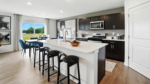 kitchen with built in island and dining space