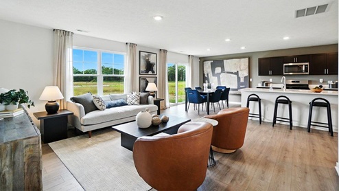 furnished great room, dining and kitchen