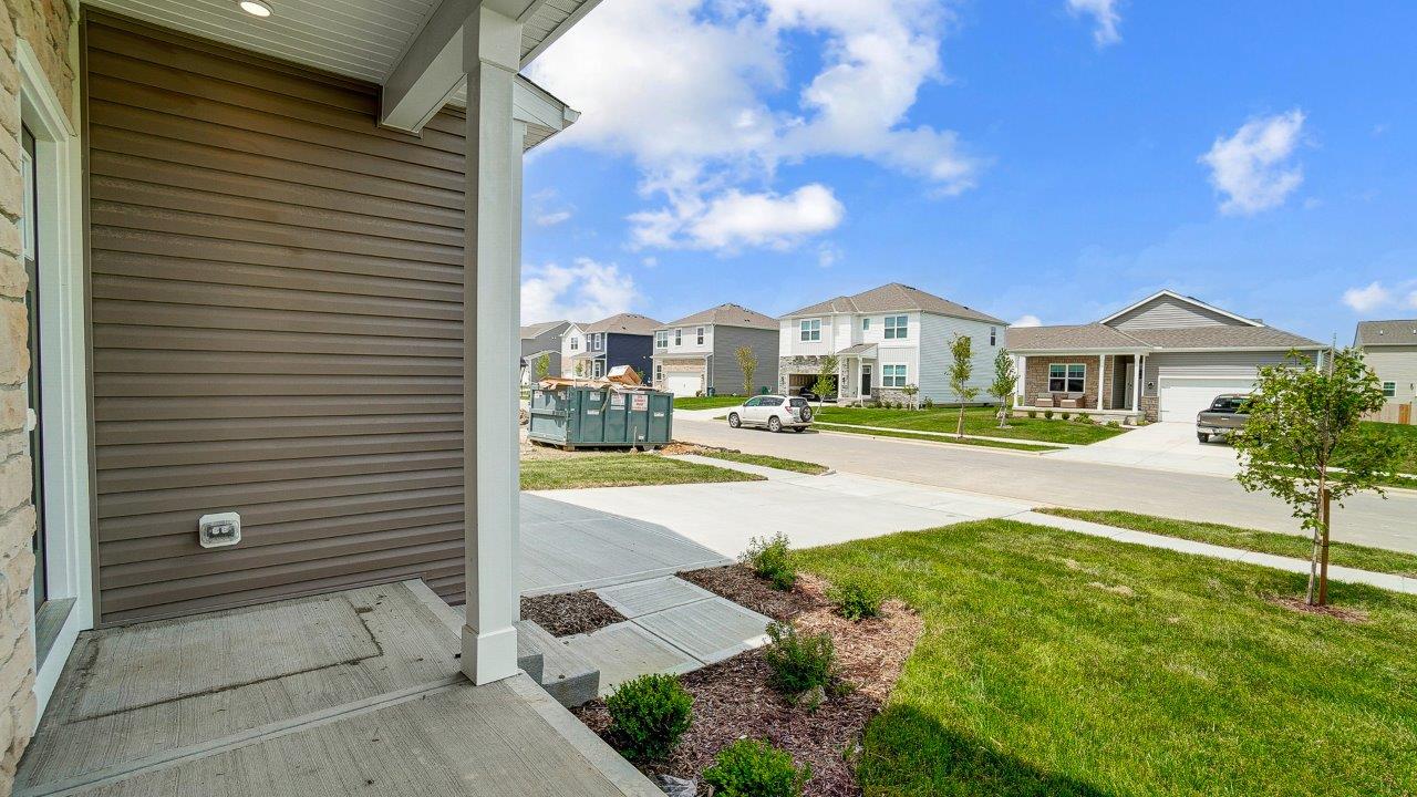 Front exterior of a two story home with a two car garage