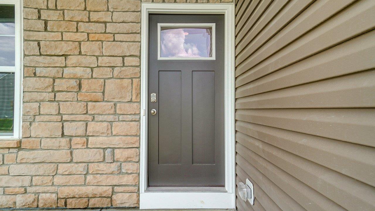 Front exterior of a two story home with a two car garage