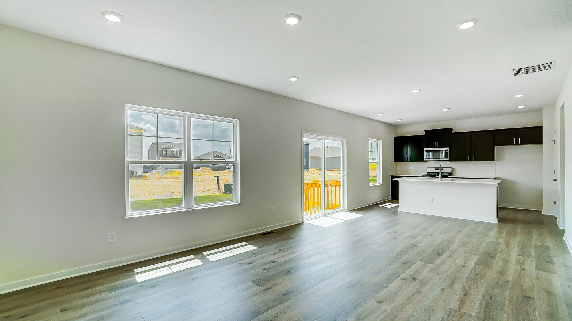 Open concept first floor with the living room and kitchen next to each other