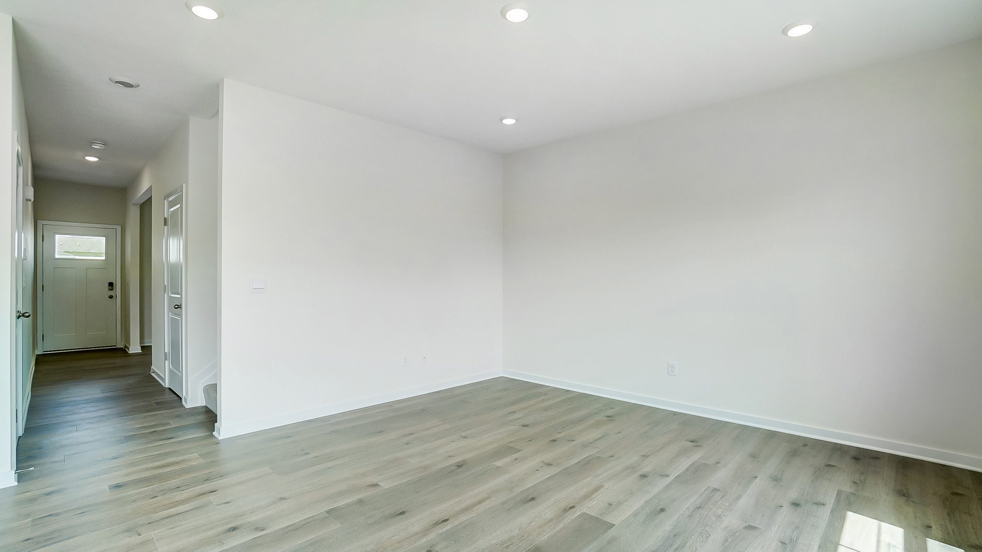 Open concept first floor with the living room and kitchen next to each other