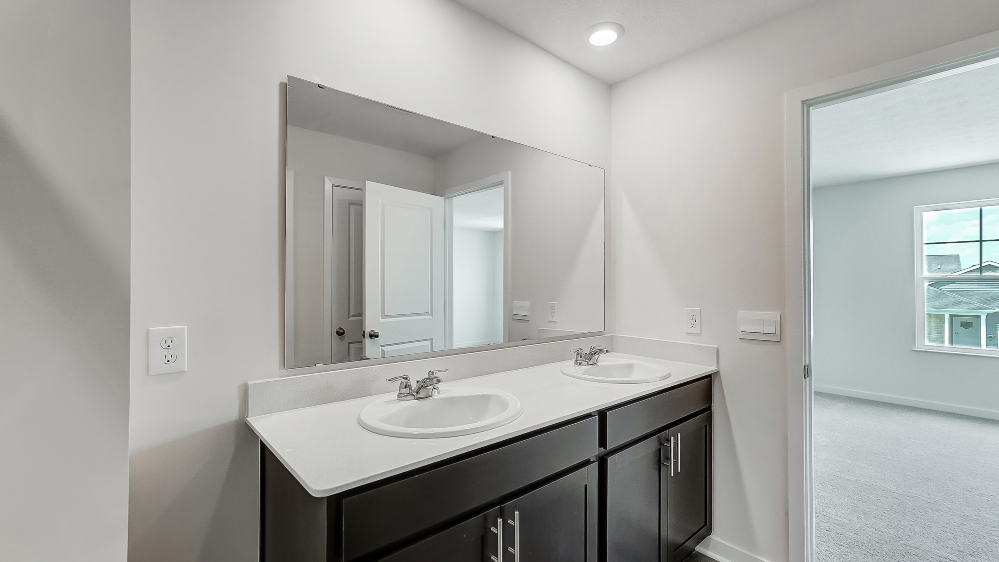 bathroom with a vanity sink, toilet and shower