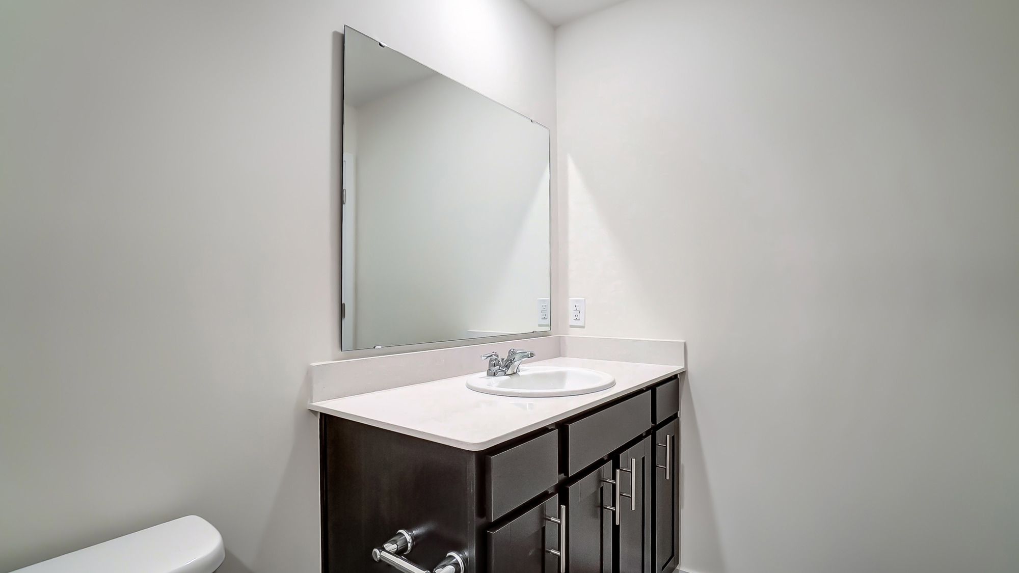bathroom with a vanity sink, toilet and shower