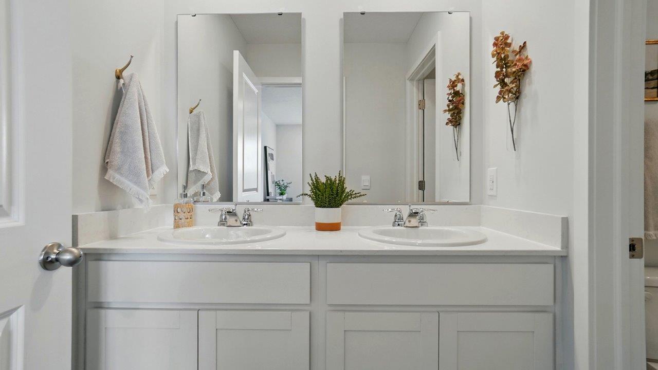 bathroom with dual vanity sinks