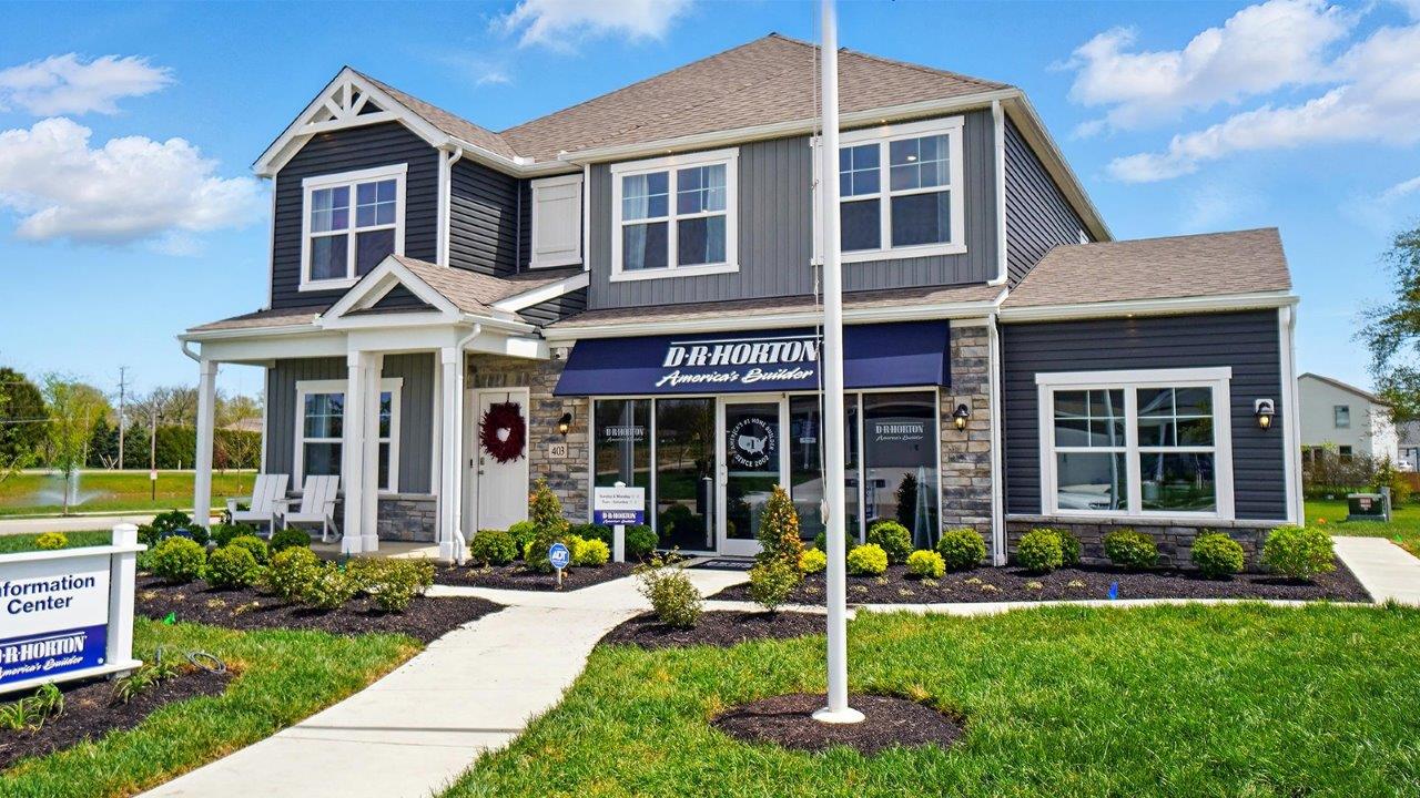 front exterior of a two story home with grey and blue siding