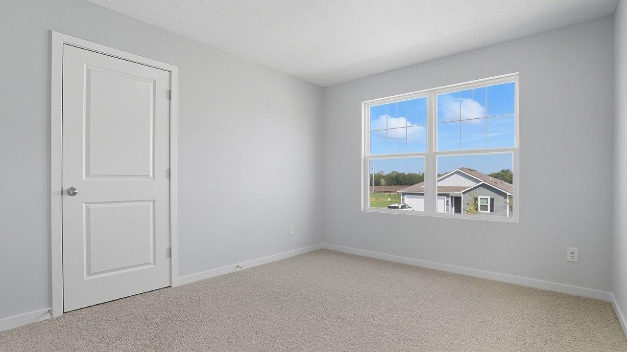 fourth bedroom with double window and closet