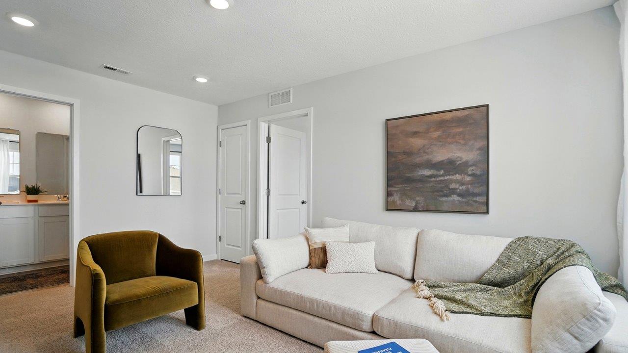 flex room featuring a sofa and a dresser with a painting above