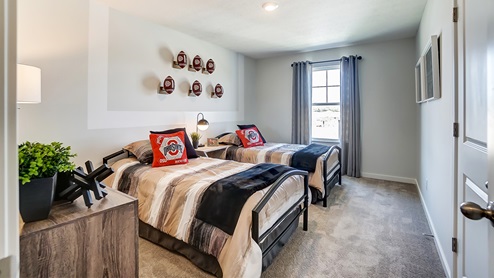 Model home secondary bedroom with two twin beds