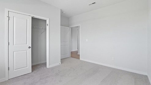 primary bedroom closet and entry