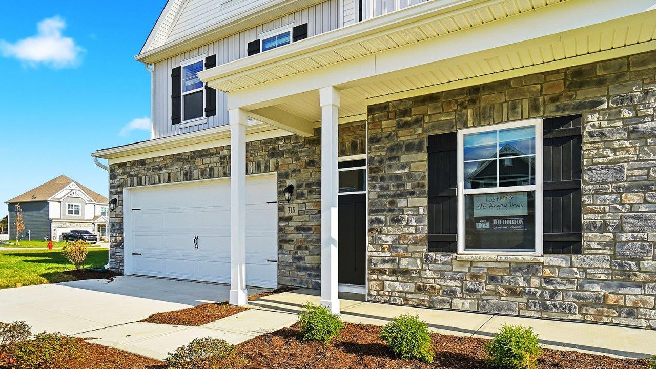 covered patio with stone front
