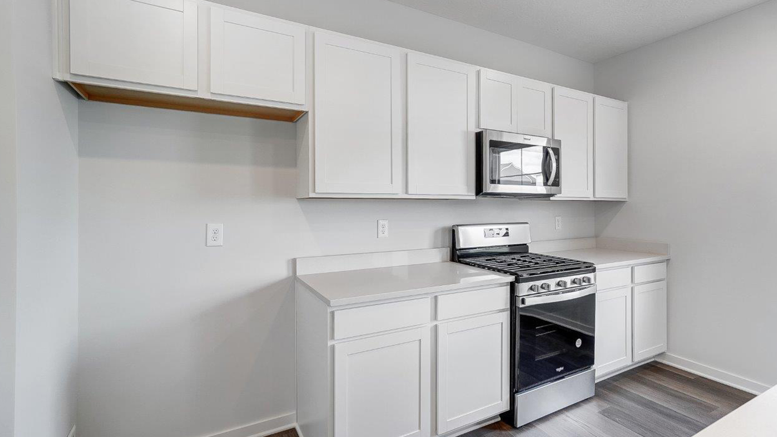 kitchen with white cabinets, stainless steel appliances
