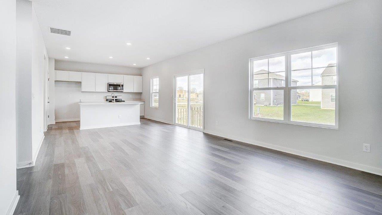 great room and kitchen, rear sliding door and double window