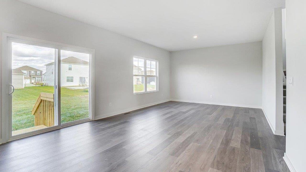 great room with rear sliding door, double window