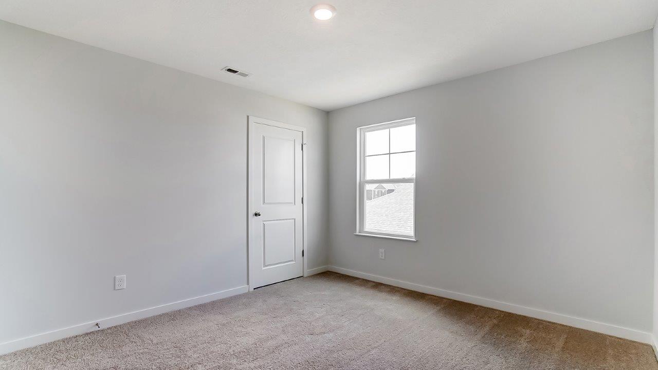 fourth bedroom with single window and closet