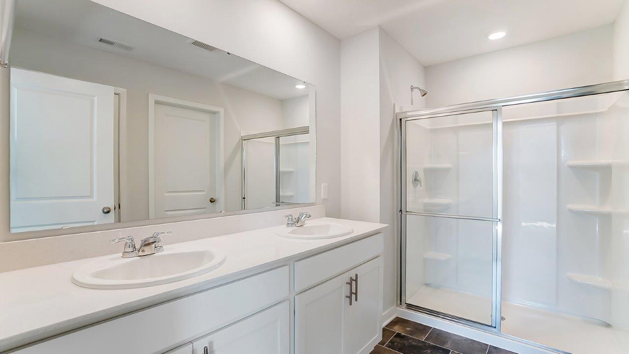 ensuite bath with double vanity and walk in shower