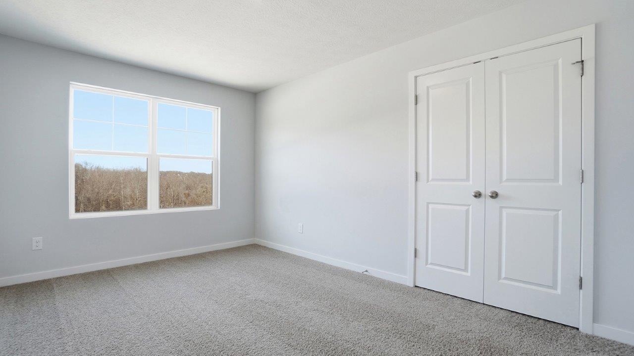 third bedroom with double window and closet