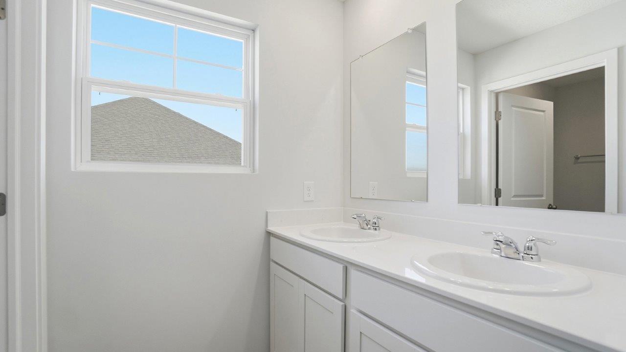 third full bath double vanity and small window