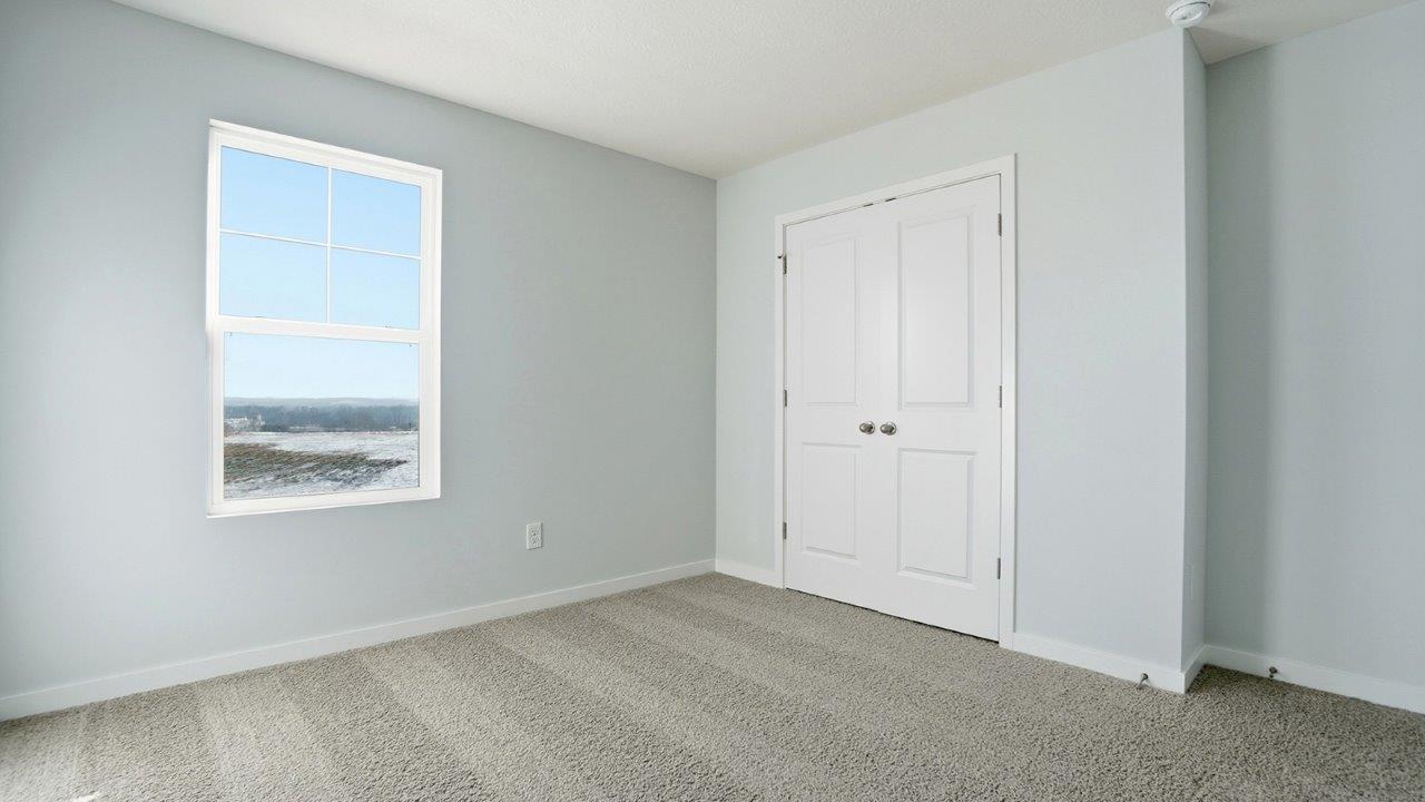 fifth bedroom with single window and closet