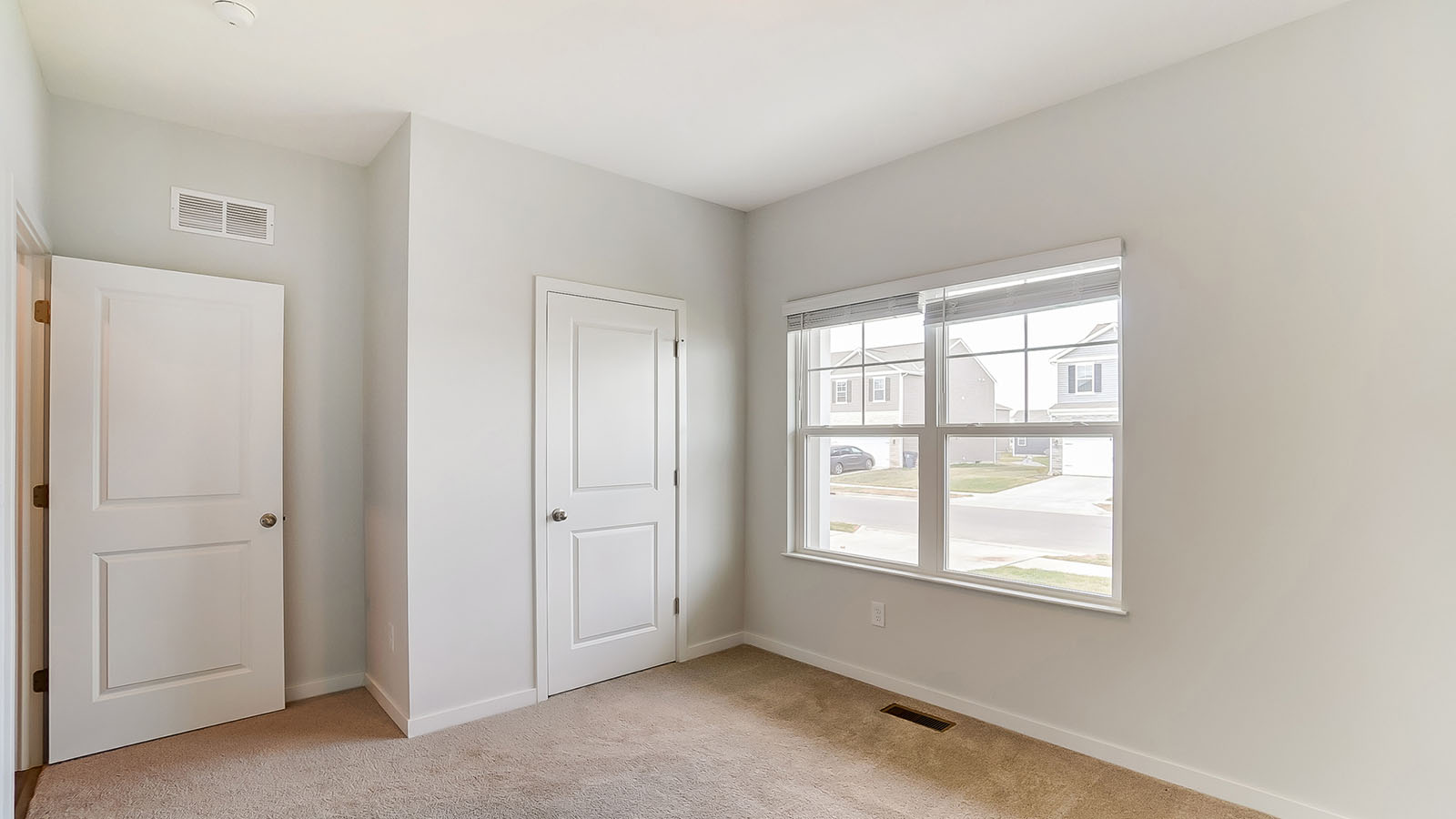 second bedroom entry, closet and double window