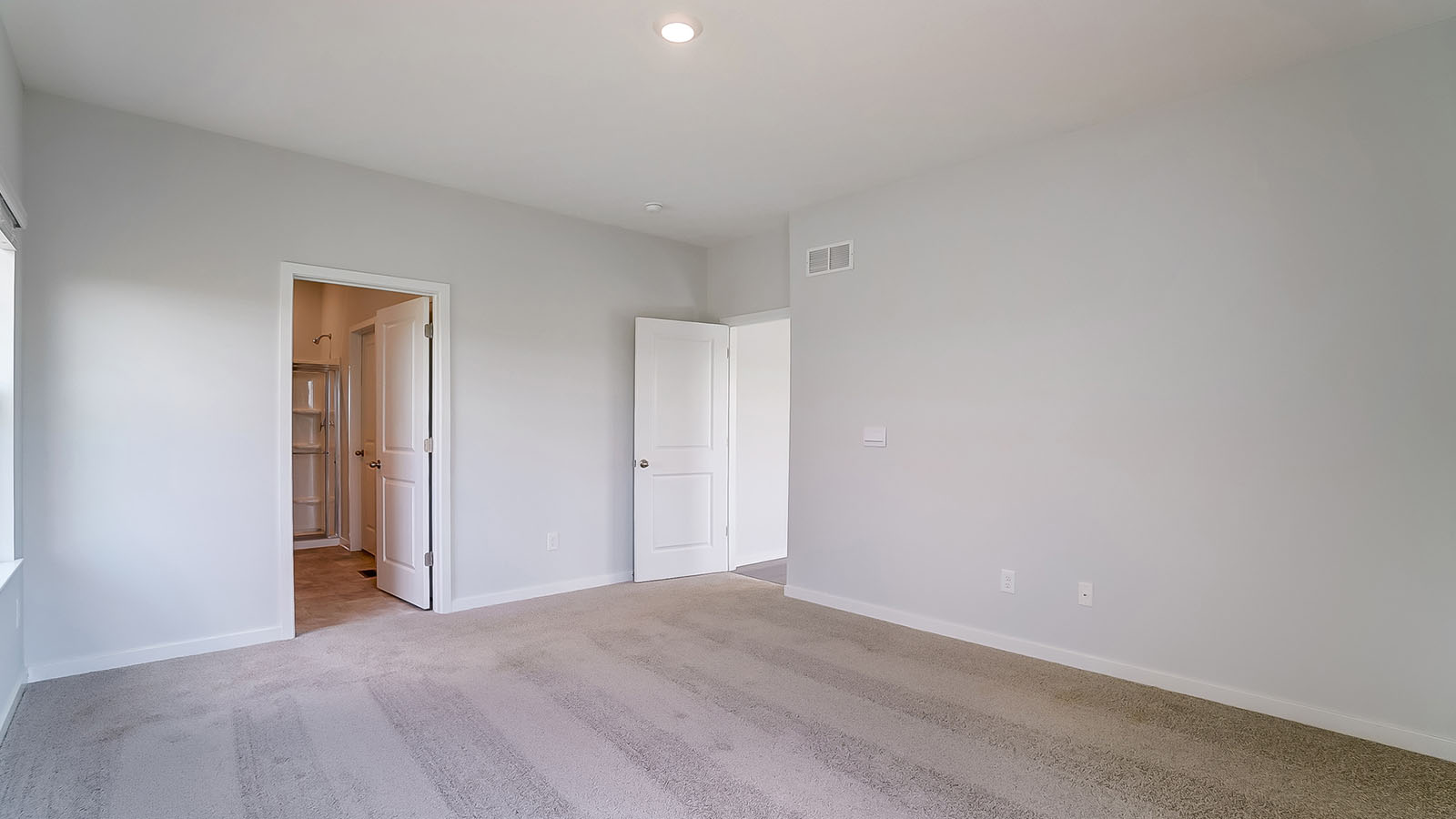 ensuite bath and primary bedroom entry