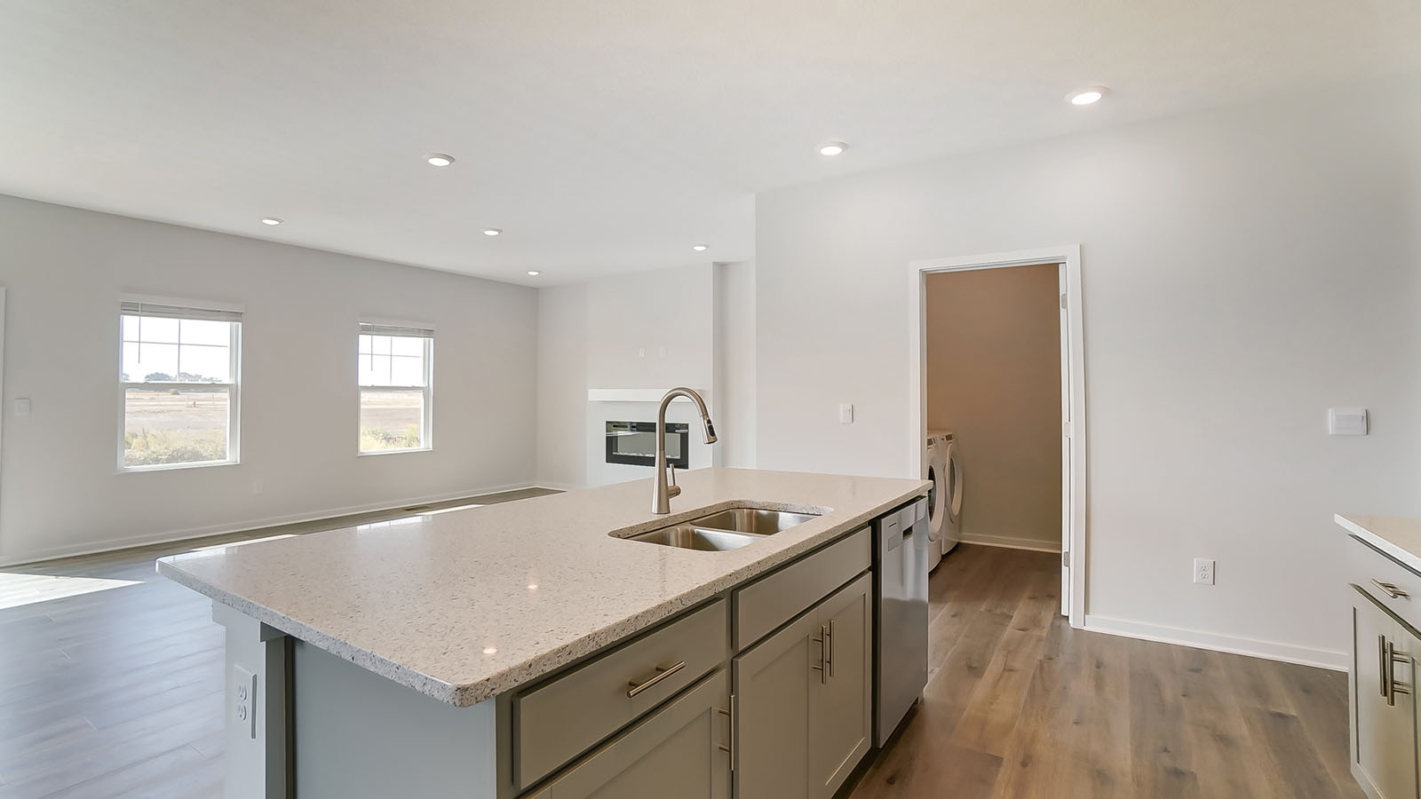 built in island, great room and laundry