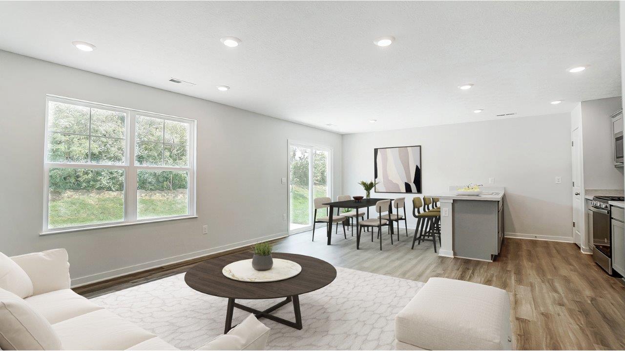 furnished great room, dining and kitchen