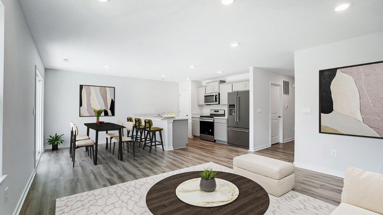 furnished great room, dining and kitchen