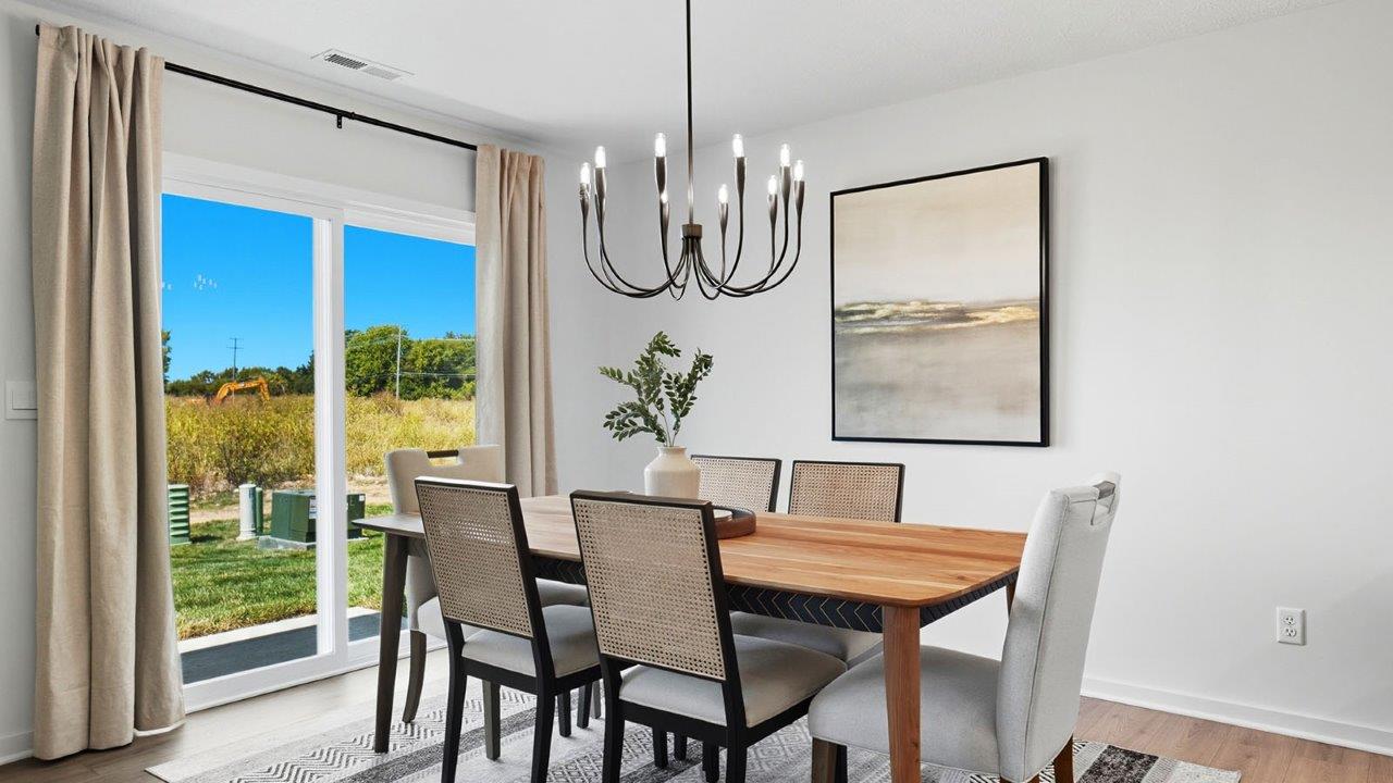 dining space with table, chairs and rear sliding door