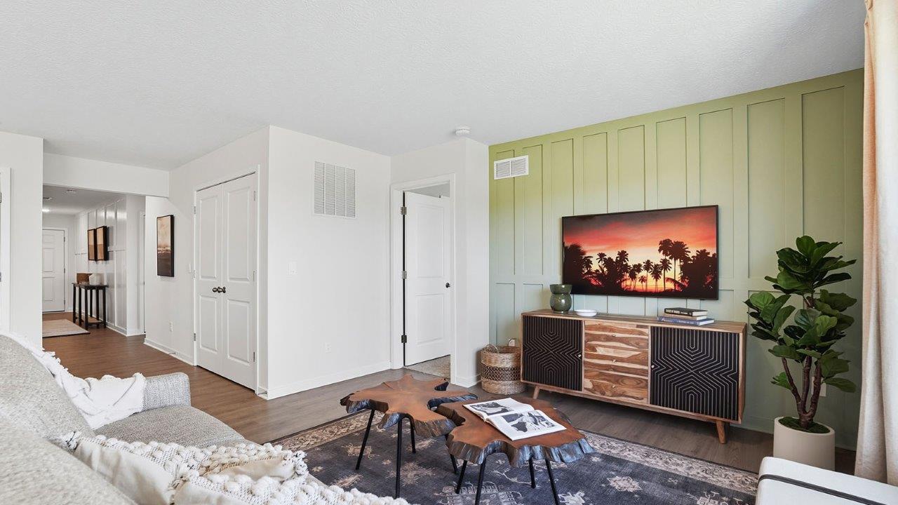 furnished great room with double window, foyer