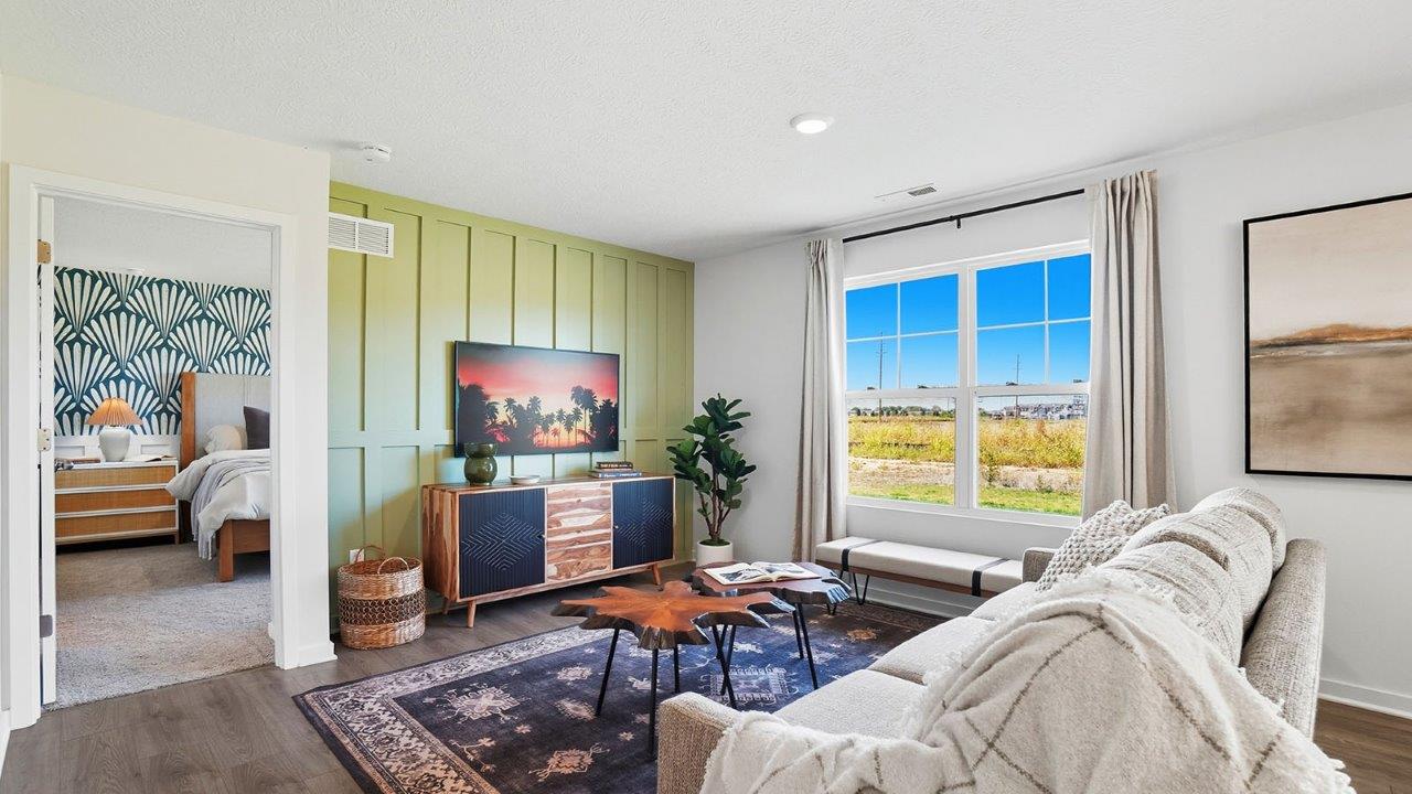 furnished great room with double window