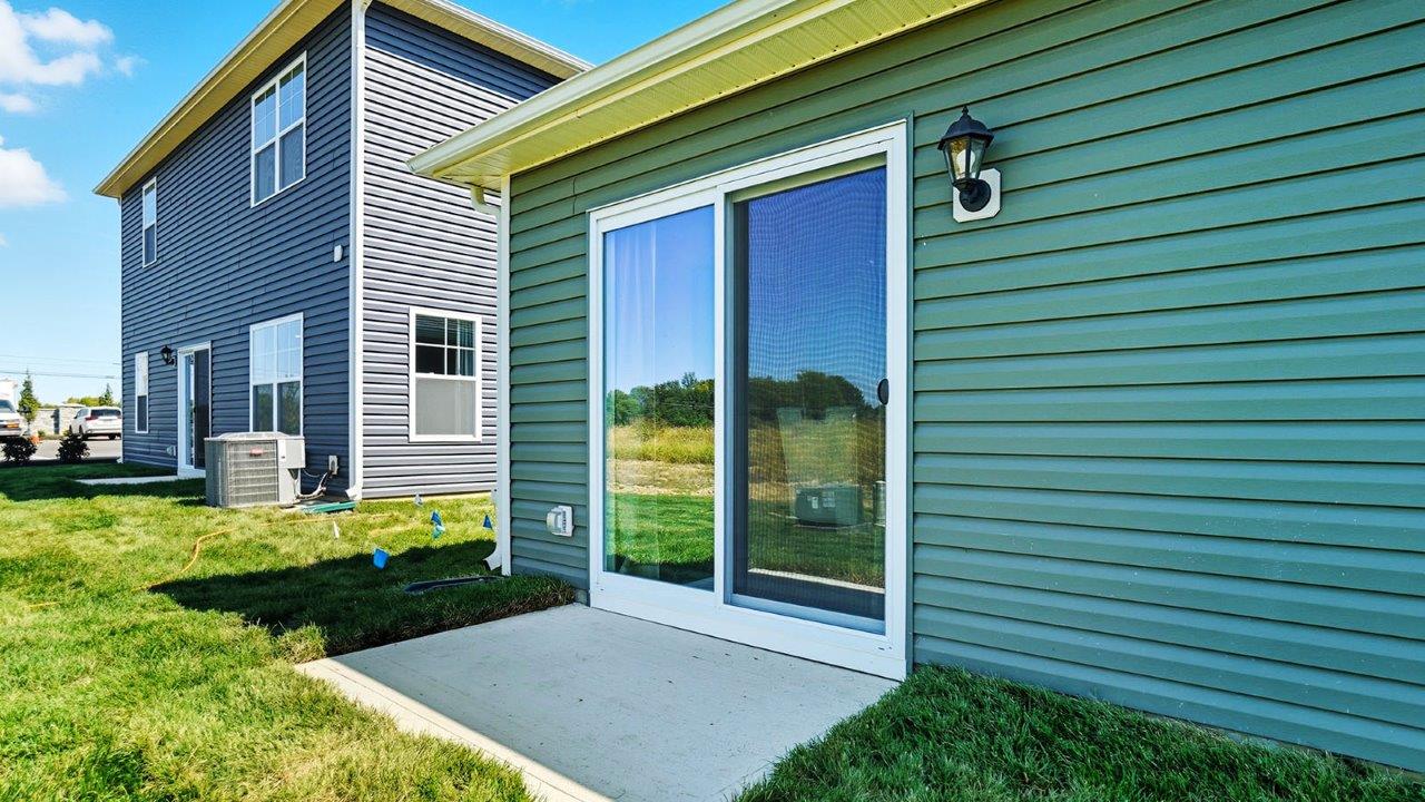 rear sliding door with concrete pad