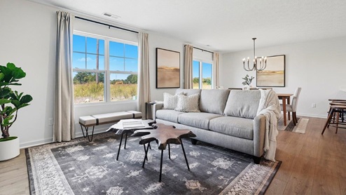 furnished great room with double window, kitchen