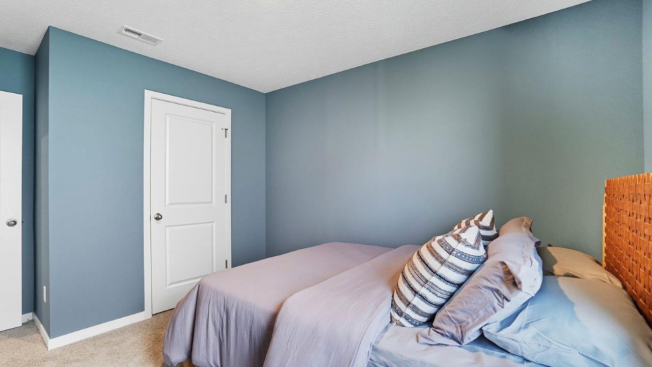 furnished third bedroom with closet