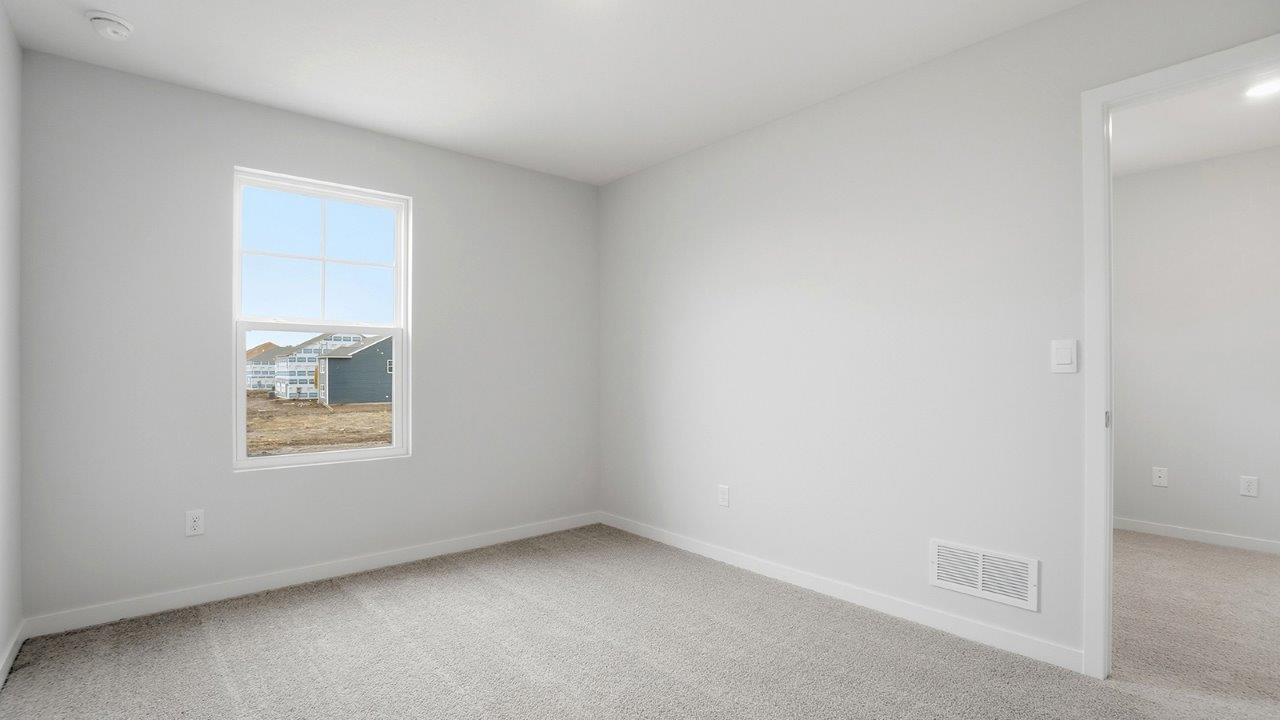 second bedroom with single window and entry