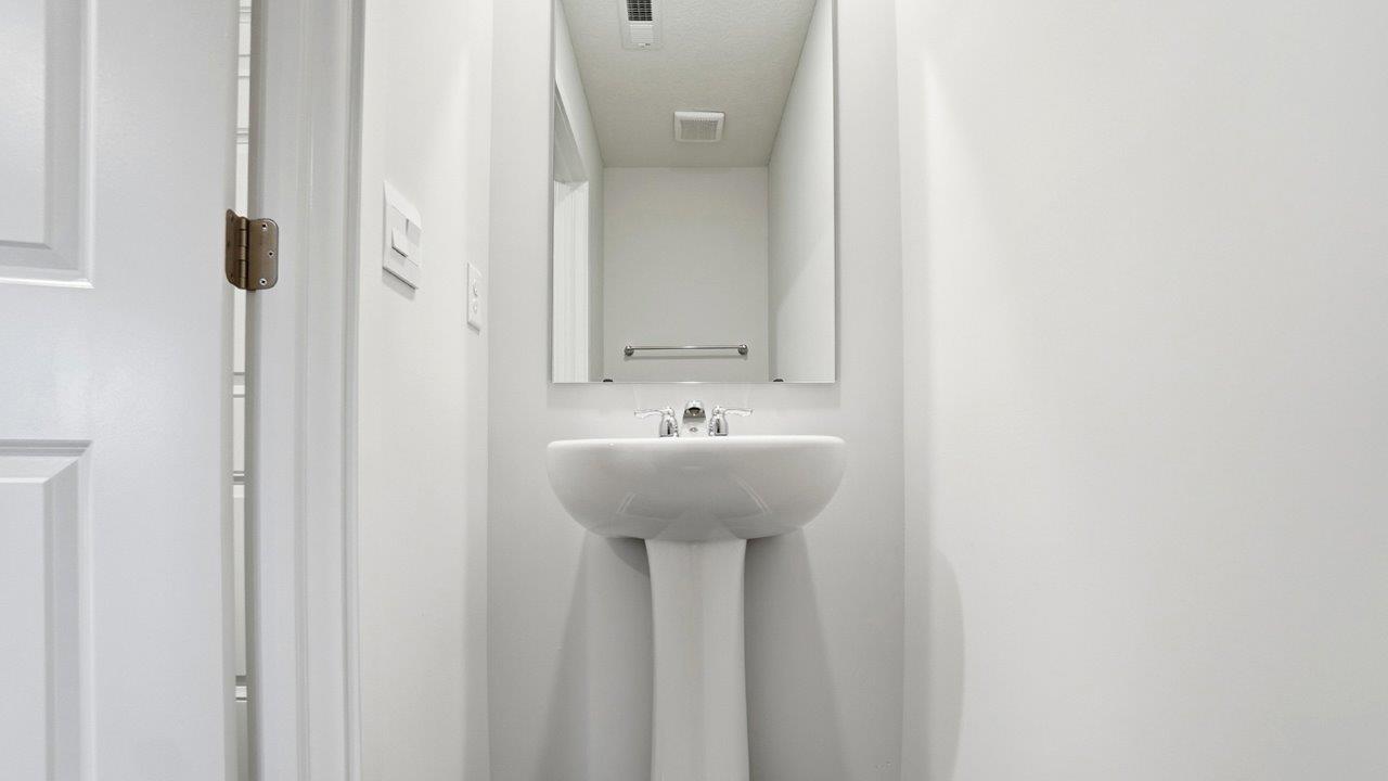 first floor powder room pedestal vanity