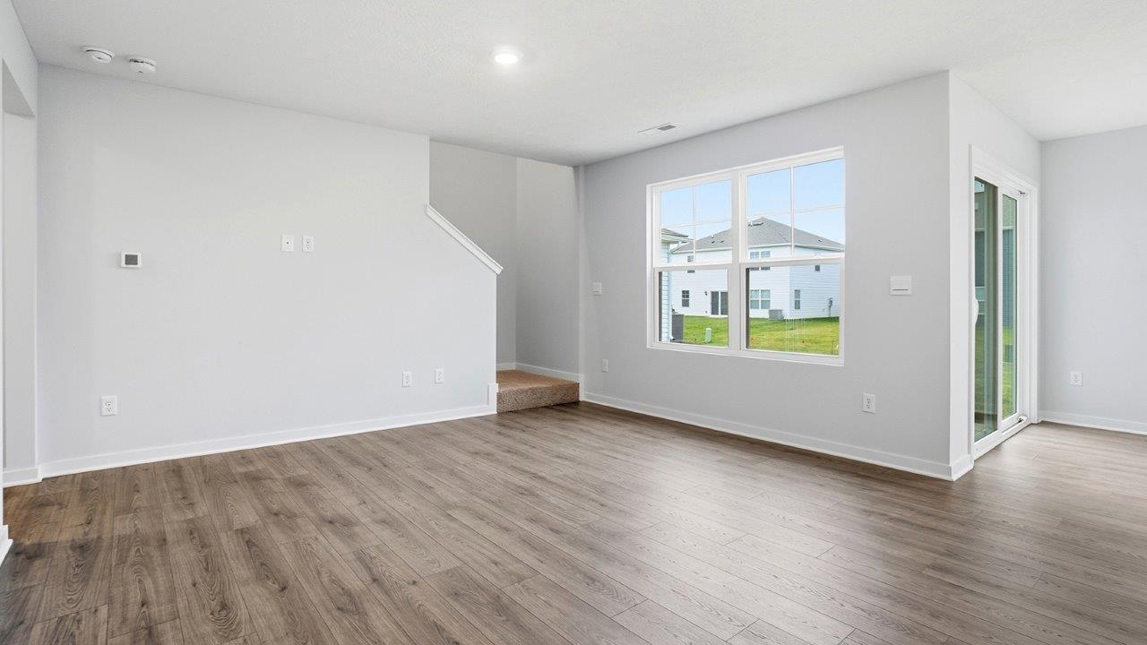 great room with double window and stairway