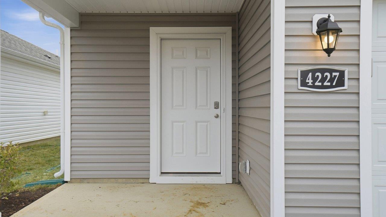 covered entry and white front door