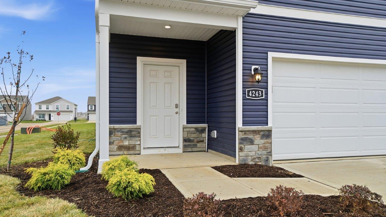 covered entry and two car garage