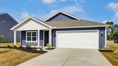 Single story home with blue siding, covered front porch, two car garage