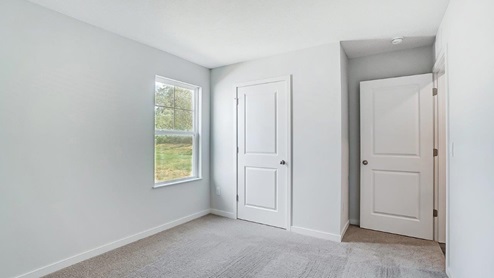 second bedroom single window, closet and entry