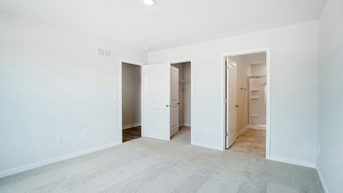 primary bedroom entry, walk in closet and ensuite bath
