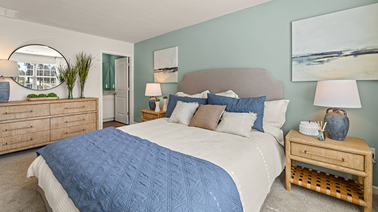 furnished primary bedroom with ensuite bath